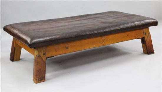 A large leather topped pommel horse rectangular coffee table, 5ft 8.5in. x 3ft 2in.